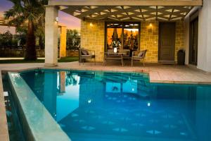The swimming pool at or close to Villa Elenitsa