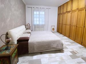 A bed or beds in a room at VILLA MOLINELLA