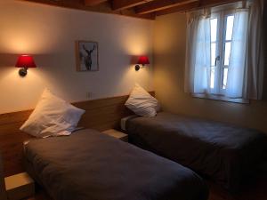 Cama o camas de una habitación en Les chalets d'Arrens