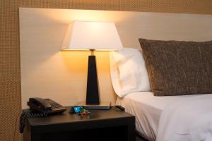 Posteľ alebo postele v izbe v ubytovaní Hotel Alborada