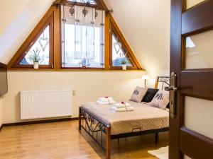 Posteľ alebo postele v izbe v ubytovaní Apartament Zacisze pod Giewontem