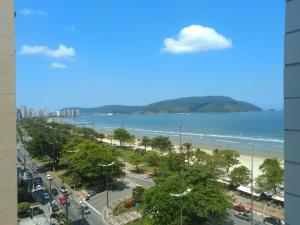 a view of a beach and the ocean from a building at Apto Frente a Praia em Santos in Santos