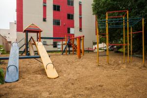 a playground with skateboards and a swing set at HOSTEL SERUSSI in Balneário Camboriú