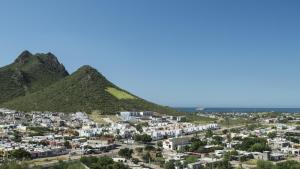 a large mountain range with a city in the distance at Holiday Inn Express Guaymas, an IHG Hotel in Guaymas