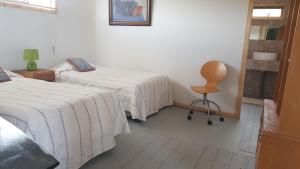 Postel nebo postele na pokoji v ubytování Tunquen Campomar Quincho y Piscina