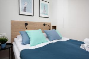 Posteľ alebo postele v izbe v ubytovaní Warsaw City Center Apartments by Noclegi Renters