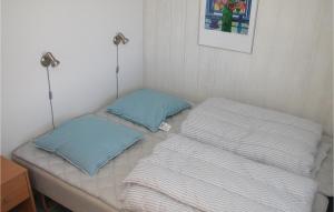 two pillows sitting on a bed in a room at Mindegården in Hejls +4 photos