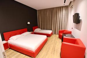 Postel nebo postele na pokoji v ubytování Aurelis Hotel