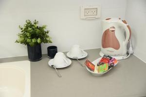 a kitchen counter with a mixer and a bowl of food at Exclusive guest room in Bene Beraq