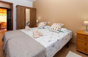 Łóżko lub łóżka w pokoju w obiekcie Vivienda Vacacional Orquidea