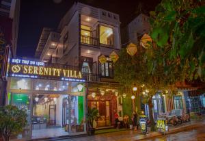 a building with a sign that reads strength villa at night at Serenity Villa Hoi An in Hoi An