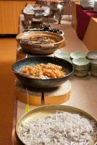 a group of bowls of food on a table at Kyukamura Iwate-Amiharionsen in Shizukuishi