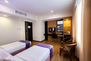 Postelja oz. postelje v sobi nastanitve Mariner Hotel Labuan