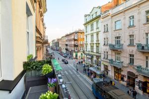 a view of a city street with buildings at Tribeca City Center Apartments in Krakow