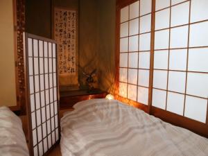 เตียงในห้องที่ Hostel Jumpu Manpan