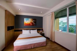 Postelja oz. postelje v sobi nastanitve Mariner Hotel Labuan