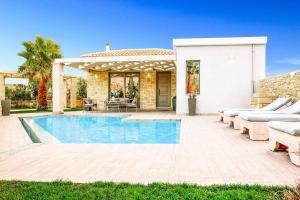 The swimming pool at or close to Villa Elenitsa