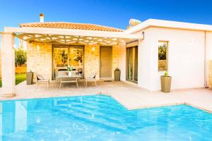 The swimming pool at or close to Villa Elenitsa