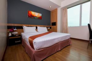 Postelja oz. postelje v sobi nastanitve Mariner Hotel Labuan
