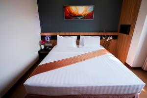 Postelja oz. postelje v sobi nastanitve Mariner Hotel Labuan