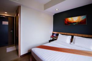 Postelja oz. postelje v sobi nastanitve Mariner Hotel Labuan