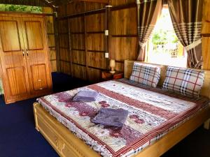 Giường trong phòng chung tại MEKONG DANIEL HOMESTAY CAN THO