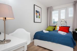 Posteľ alebo postele v izbe v ubytovaní Warsaw City Center Apartments by Noclegi Renters