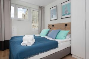 Posteľ alebo postele v izbe v ubytovaní Warsaw City Center Apartments by Noclegi Renters