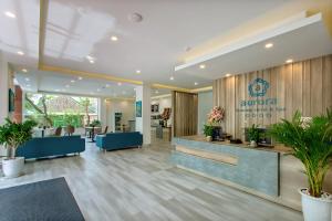 a lobby of an office building with a reception desk at Hoi An Aurora Riverside Hotel and Spa in Hoi An