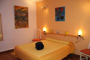 Postel nebo postele na pokoji v ubytování L'Almàssera Casa Rural & Restaurant