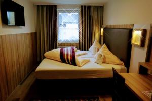 Säng eller sängar i ett rum på Hotel Gasthof Markterwirt