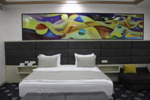 Ένα ή περισσότερα κρεβάτια σε δωμάτιο στο Erebuni Hotel Yerevan