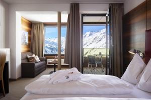 Postel nebo postele na pokoji v ubytování Hotel Angerer Alm + 37 fotografií