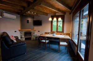 a living room with a table and a couch at Casa Llop in Espot