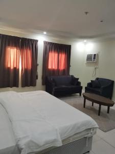 Postel nebo postele na pokoji v ubytování شقق دخيل بن نقا بن شنيشيل الرحيلي للشقق المخدومة + 19 fotografií