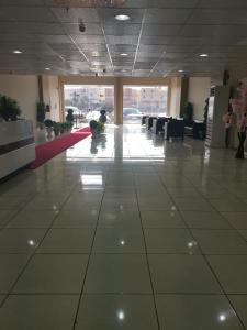 a large room with a large tile floor in a building at Golden Dakhil in Al Madinah