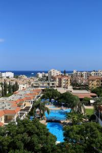 a city with lots of buildings and a river at Jacaranda Hotel Apartments in Protaras