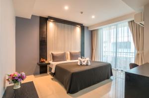Кровать или кровати в номере Lada Krabi Residence Hotel - SHA Plus