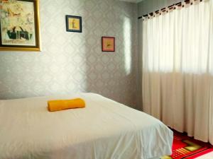 Voodi või voodid majutusasutuse Jos & Hanny Homestay toas