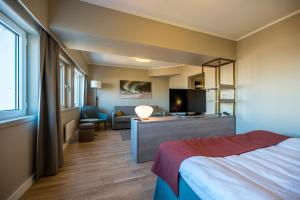 Postel nebo postele na pokoji v ubytování Quality Hotel Saga