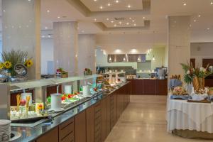 a kitchen filled with lots of counter top space at Kresten Palace Hotel in Kallithea Rhodes