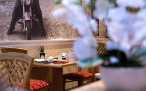a small table and chairs in a room with a table and chairs at ... mein romantisches Hotel Toalstock in Fiss