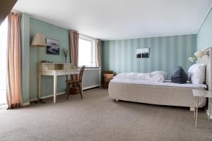 Postel nebo postele na pokoji v ubytování Helenekilde Badehotel