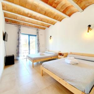 Postel nebo postele na pokoji v ubytování B&B La Nava Suites