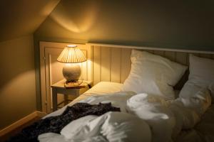 Postel nebo postele na pokoji v ubytování Helenekilde Badehotel