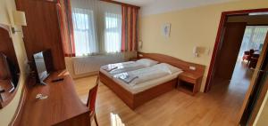 Postel nebo postele na pokoji v ubytování Hotel Angerer-Hof