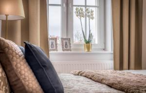 Posteľ alebo postele v izbe v ubytovaní Apartament Diamentowy