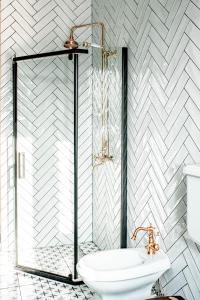 a bathroom with a glass shower and a toilet at Апартаменти Стара Ворохта in Vorokhta +67 photos