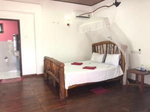 Letto o letti in una camera di Sigiri Lion Lodge