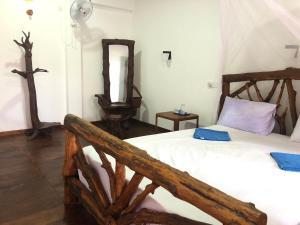 Letto o letti in una camera di Sigiri Lion Lodge
